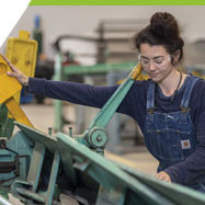 Morganna, a sheet-metal student working in the Sheet Metal Shop