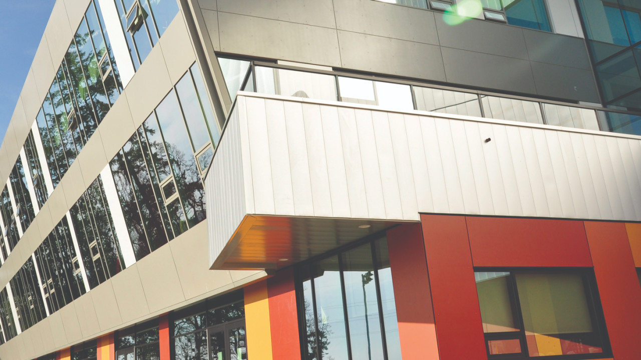 A close up the PISE building at sunset