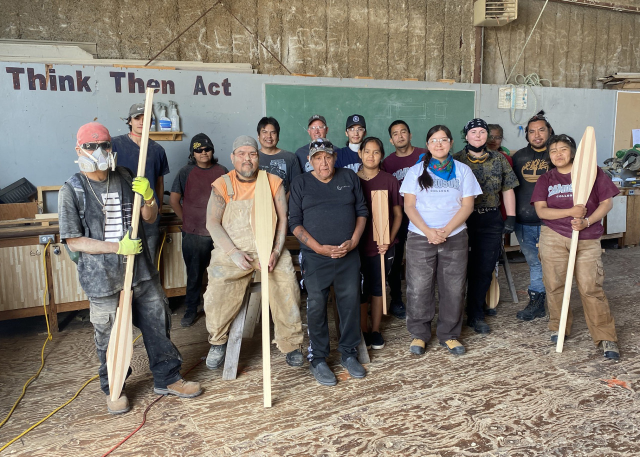 Students involved in carving paddles