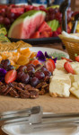 A platter of fresh fruit and cheese.