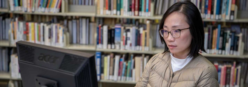 Study using a computer in the library