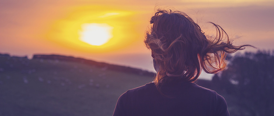 woman looking at sun