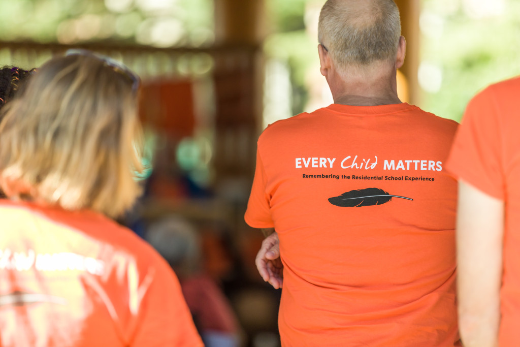 An orange shirt printed with the words "every child matters"