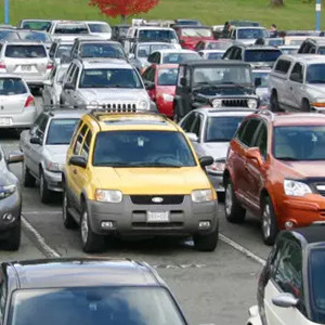 A large parking lot packed with cars.