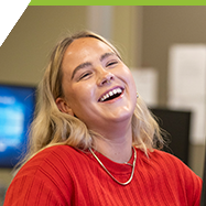 Sydney laughing in the Computer Science lab.