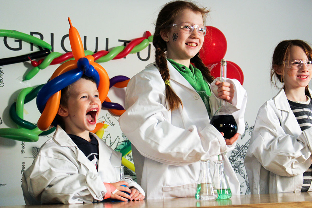 3 kids wearing lab coats