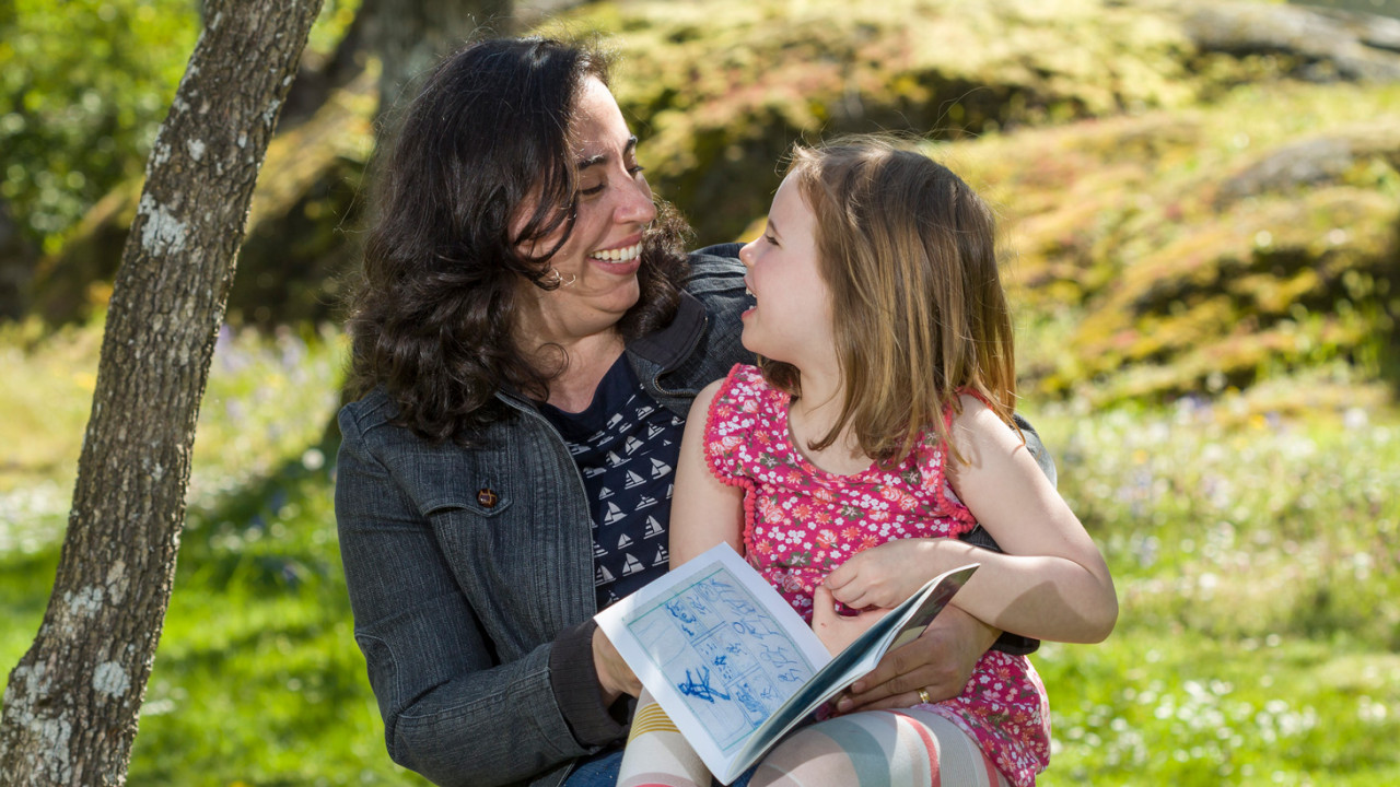 ECE student reading to a child aged 5