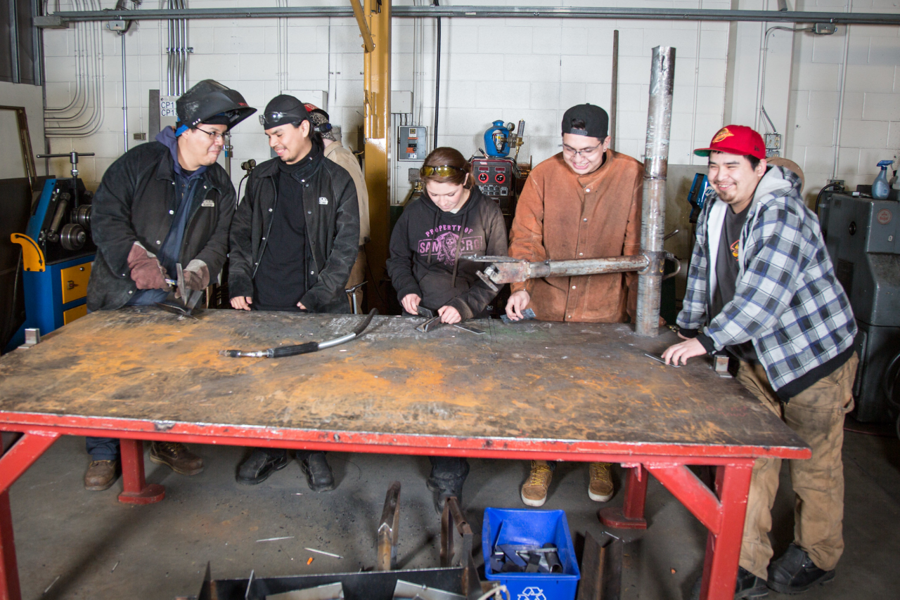 group of students around work bench