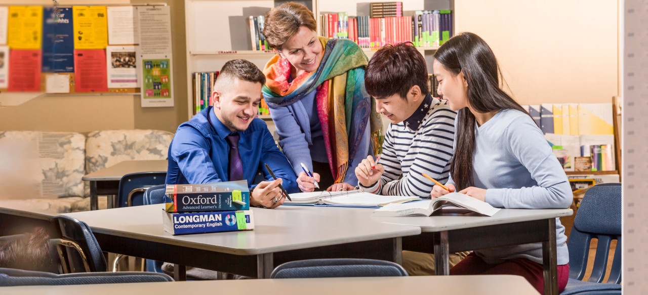 Instructor and students at table