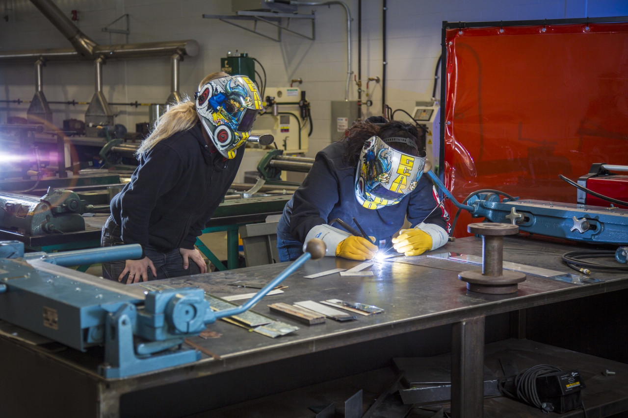 two women welding