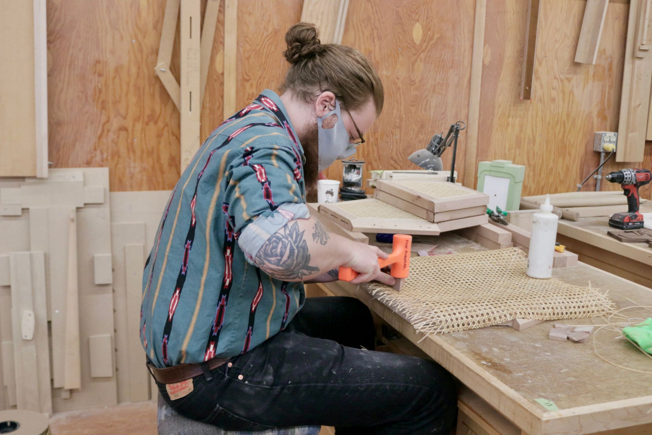 A Fine Furniture and Joinery student working in the woodshop 