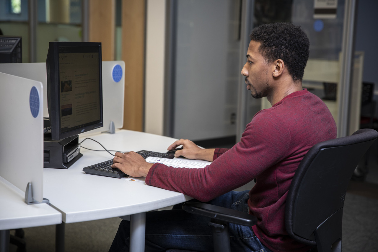 A student using a library computer