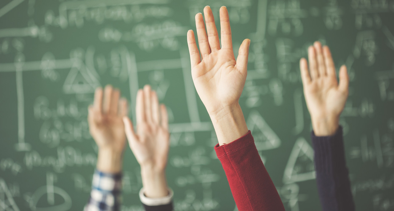 raised hands in math classroom