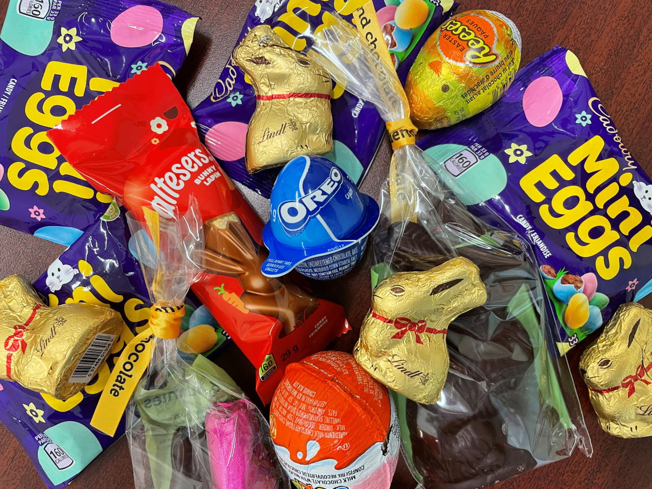 A pile of easter chocolate and bags of candy