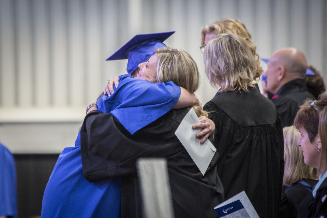 Camosun graduate hugging parent