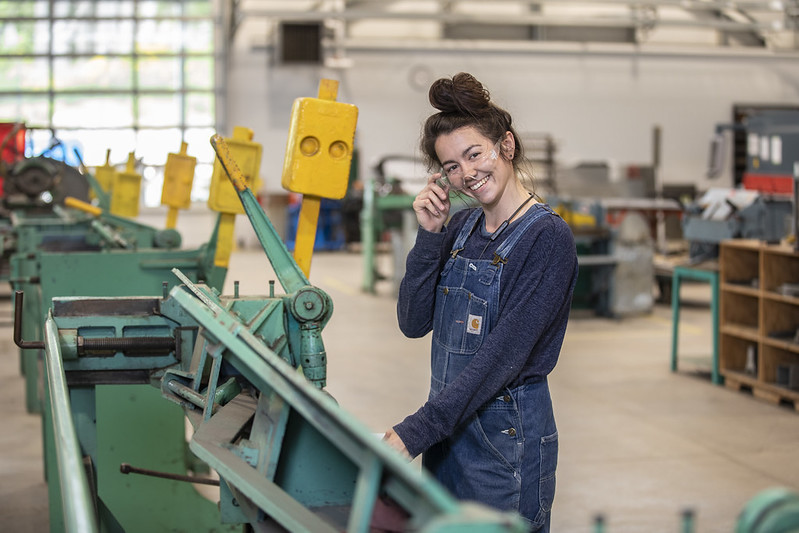 Sheet metal student Morganna smiling in the shop