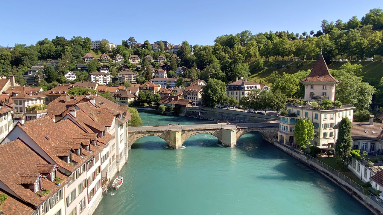 River going through Bern Switzerland with a bridge in the background