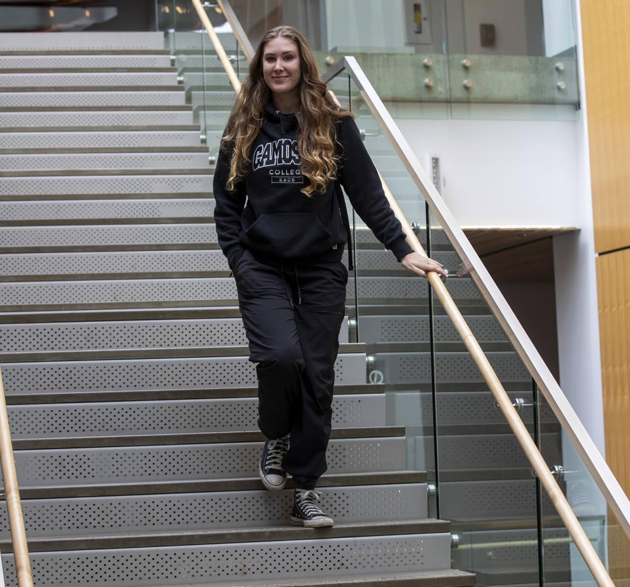 Olivia Van Bruggen - Student walking down stairs - Community Support and Education Assistant program