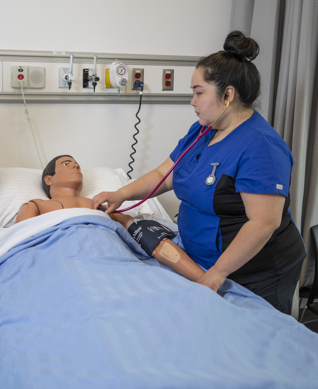 Student checking on patient