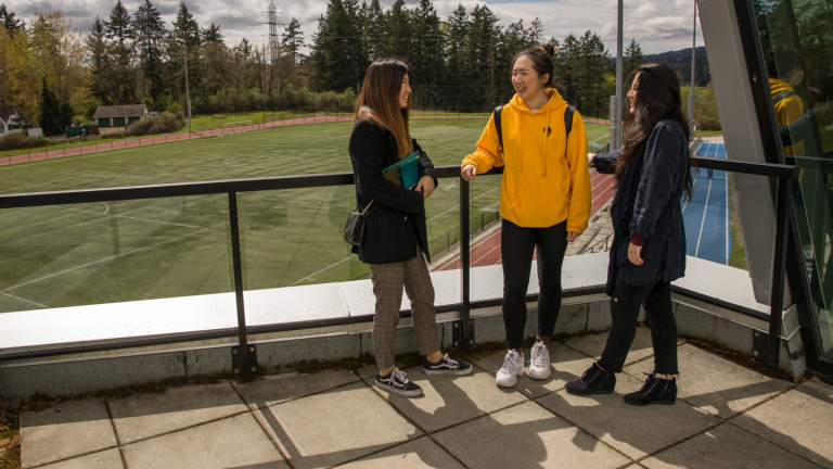 International Students by chatting by the Sports Field 