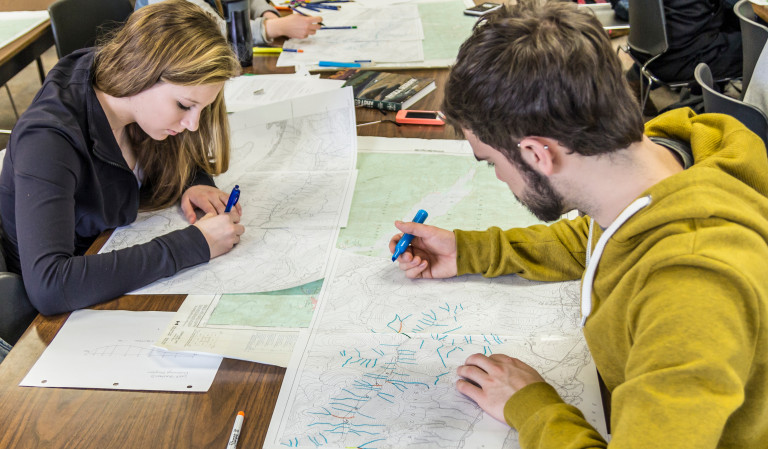 Two students reading map 