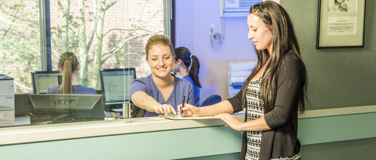 Patient filling in forms at a medical office