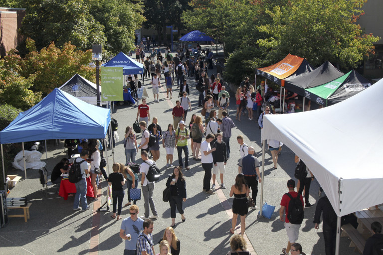 An elevated view of crowds around tents during CamFest