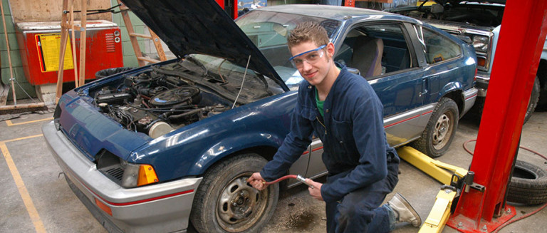 Auto Tech dual credit student working on car