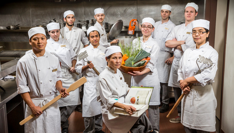 A group of culinary arts students in the ClassRoom kitchen.