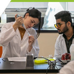 Two students working on a test in the science lab 