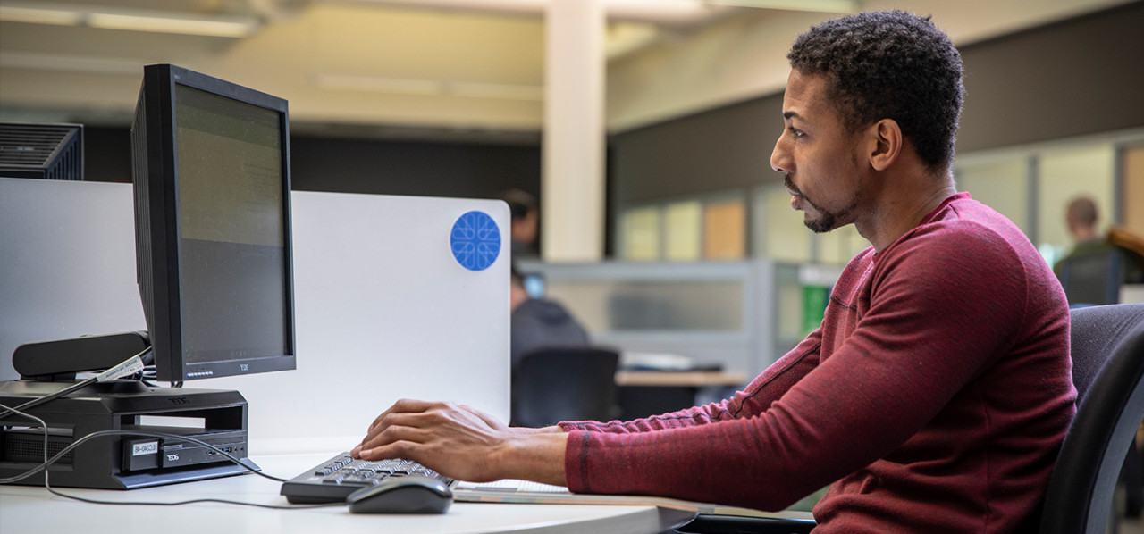 A Camosun student using the computers in the library