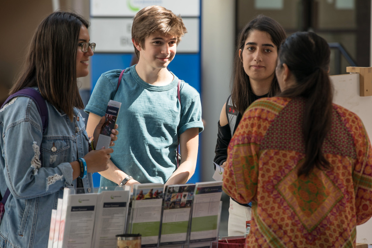 Students at a college information booth