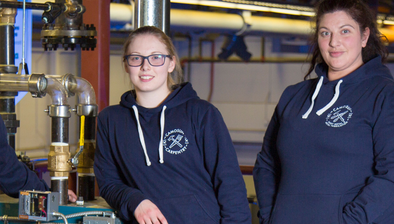 Two students sporting Camosun Carpentry Hoodies from the Bookstore