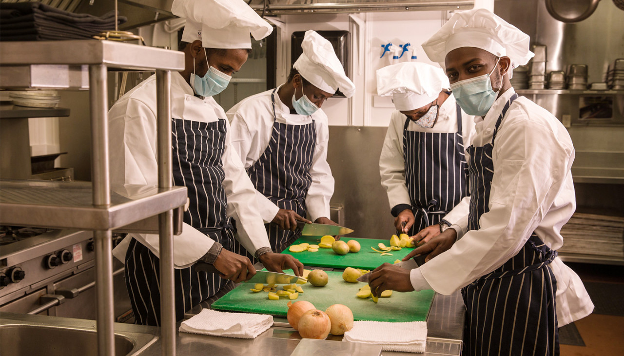 Students get hands on experience working in the Class Kitchen.