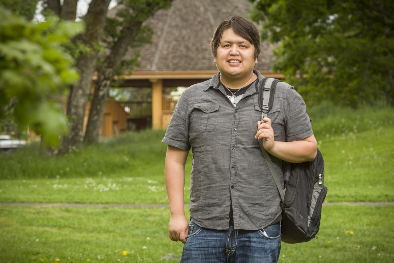 Indigenous Student stands outside on the Lansdowne campus.