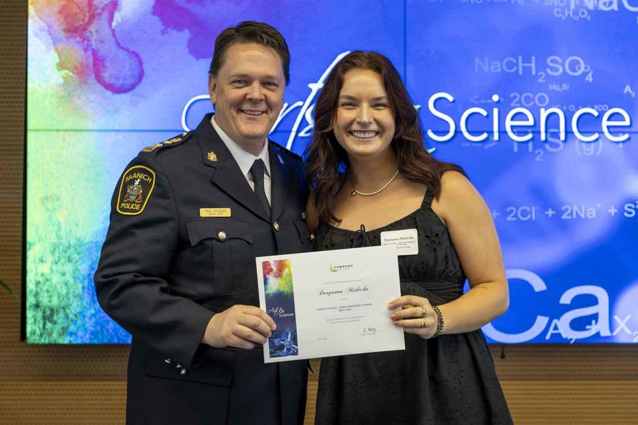 Donor and recipient pose for photo after being awarded an Arts & Science award
