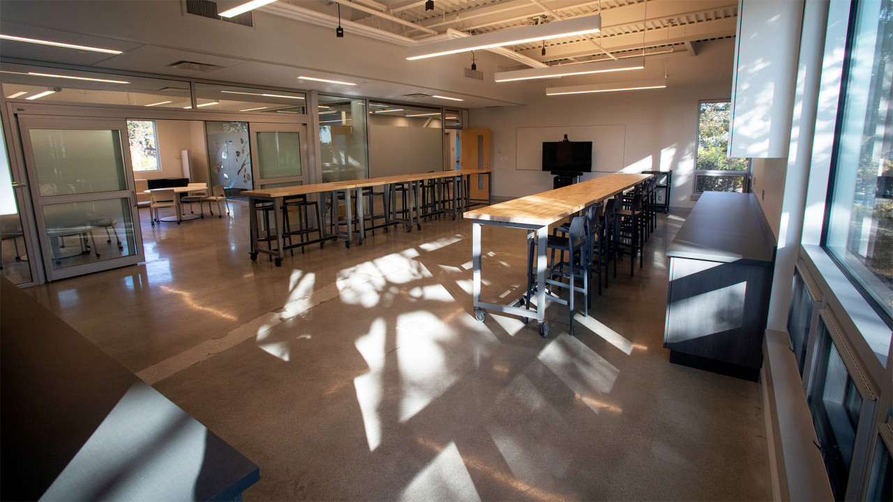 Makerspace collaboration room with open space, high top tables and space for various technologies dedicated to making