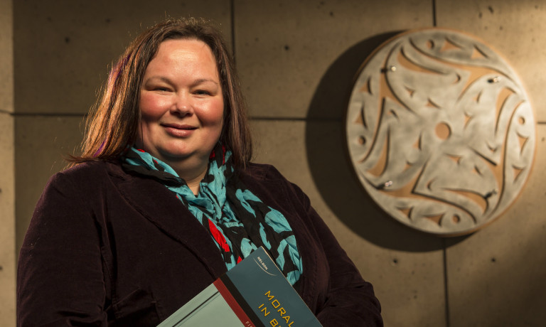 IFS Indigenous student with textbook