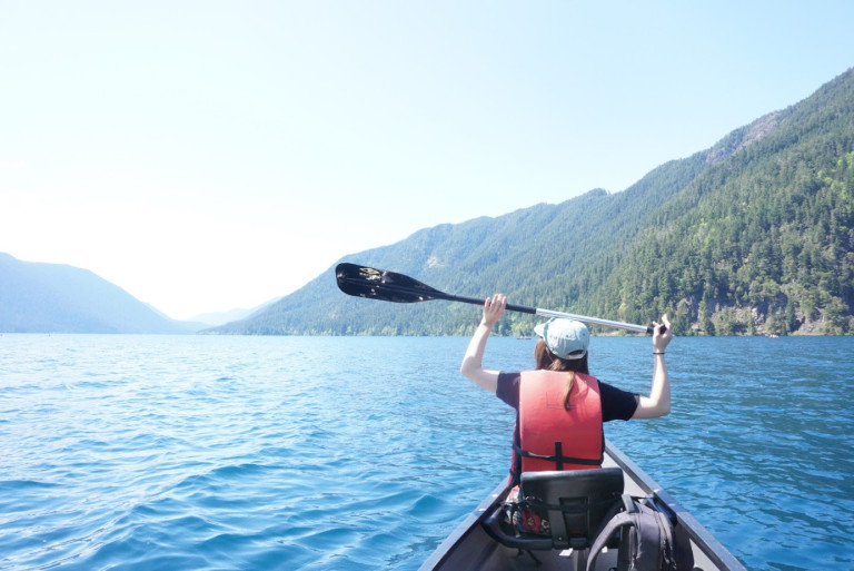 A CELA student canoeing in the mountains.