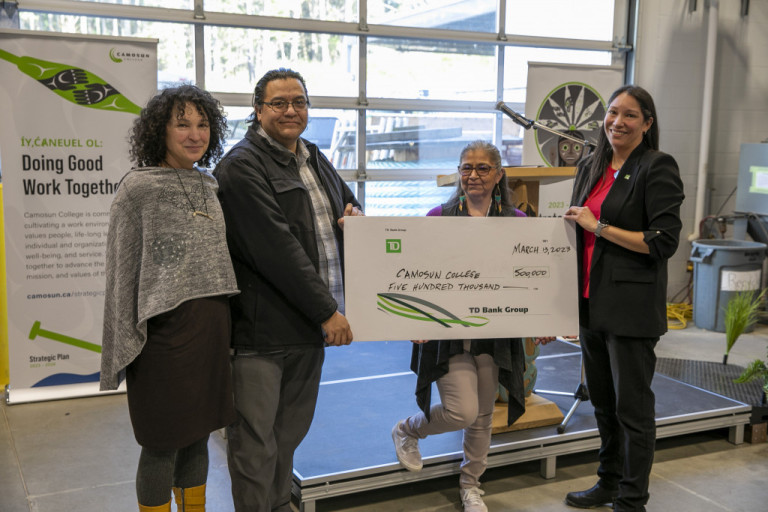 Four people hold a large cheque from TD made out to Camosun College for $500,000